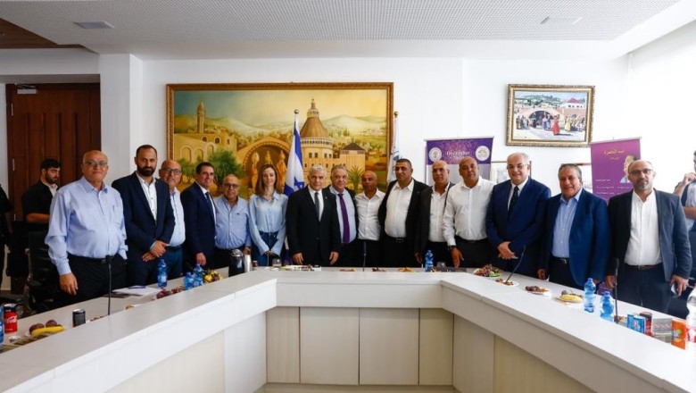 Lapid receives lukewarm welcome in Nazareth amid push for Arab voters to go to the polls